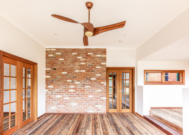 Living room showing brick feature wall